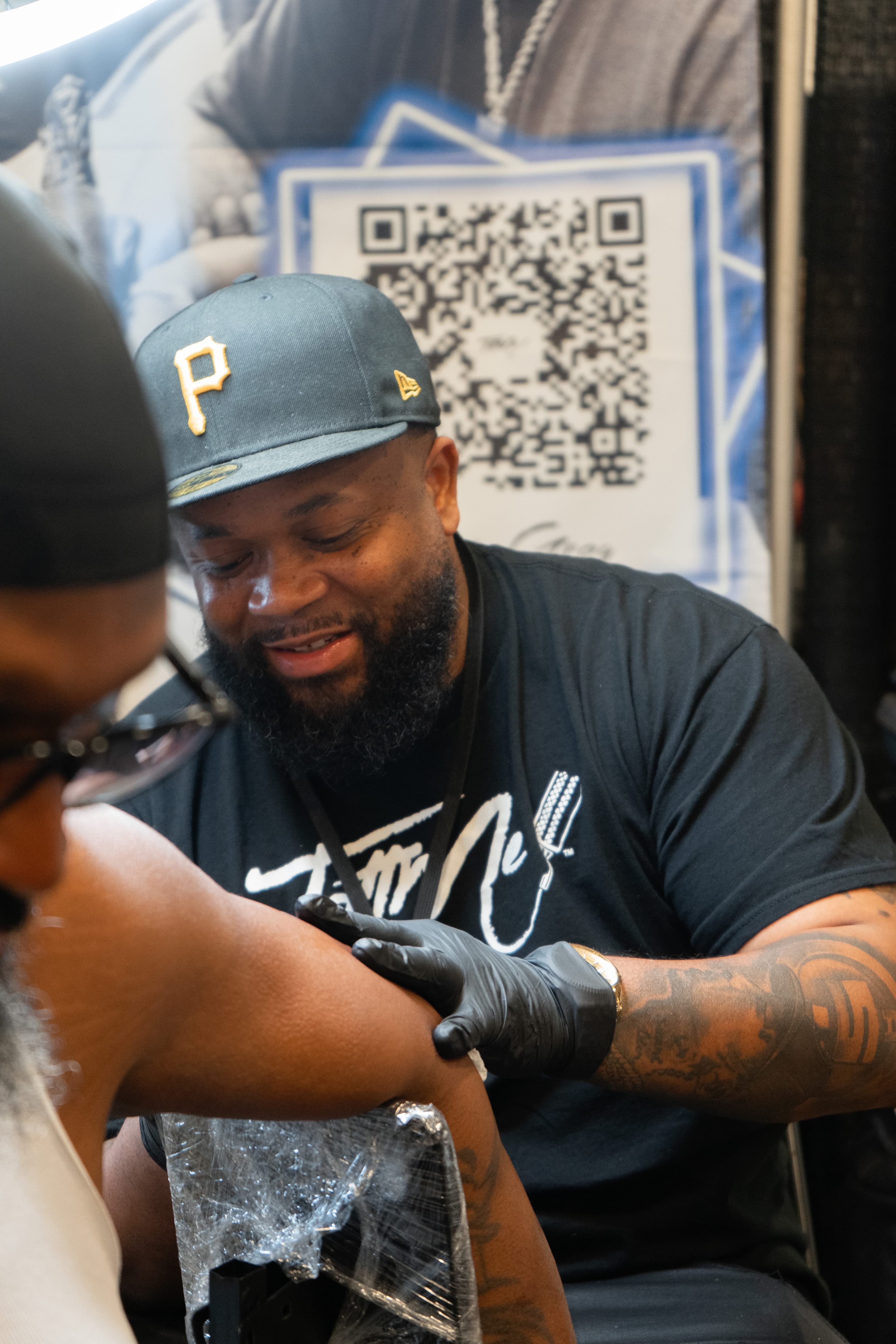 Tattoo artist at work on TattMe, scene 2