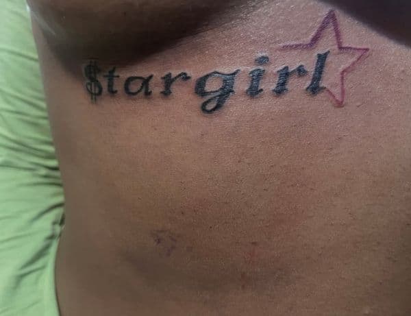 Lettering + Script stargirl tattoo on Ribs by Tatsbykhi on TattMe