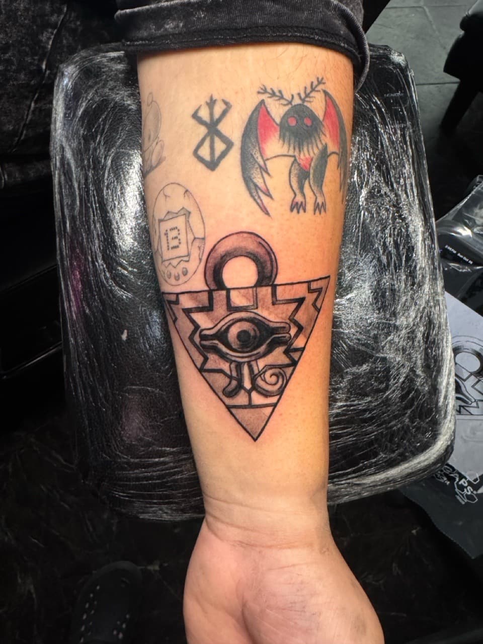 American Traditional + Pop Culture millennium puzzle tattoo on Forearm by 1UP_Uncle_Frecks on TattMe