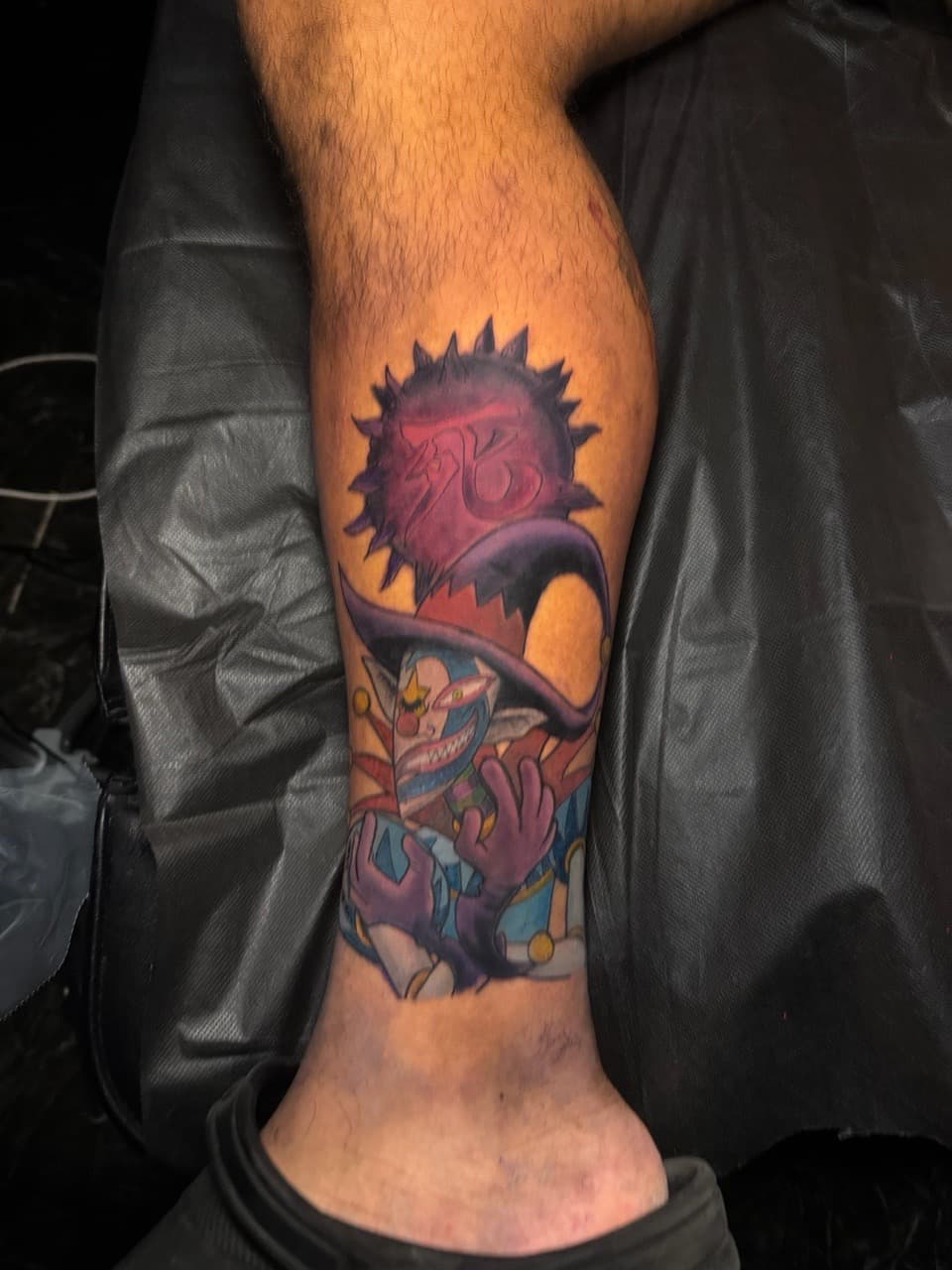 New School + Cartoon jester tattoo on Calf by 1UP_Uncle_Frecks on TattMe