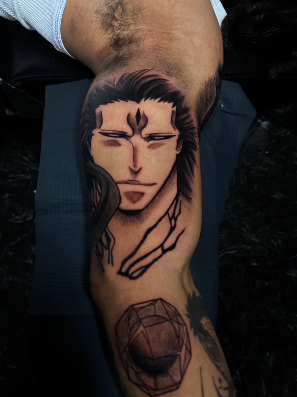 Anime + Geometric anime character tattoo on Upper Arm by 1UP_Uncle_Frecks on TattMe