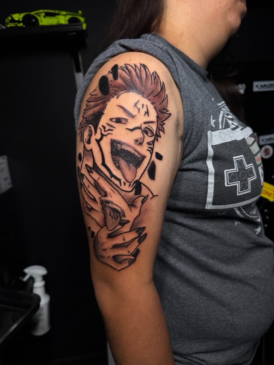 Anime + Illustrative face tattoo on Upper Arm by 1UP_Uncle_Frecks on TattMe