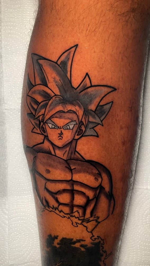 Anime + Black & Grey goku tattoo on Calf by 1UP_Uncle_Frecks on TattMe
