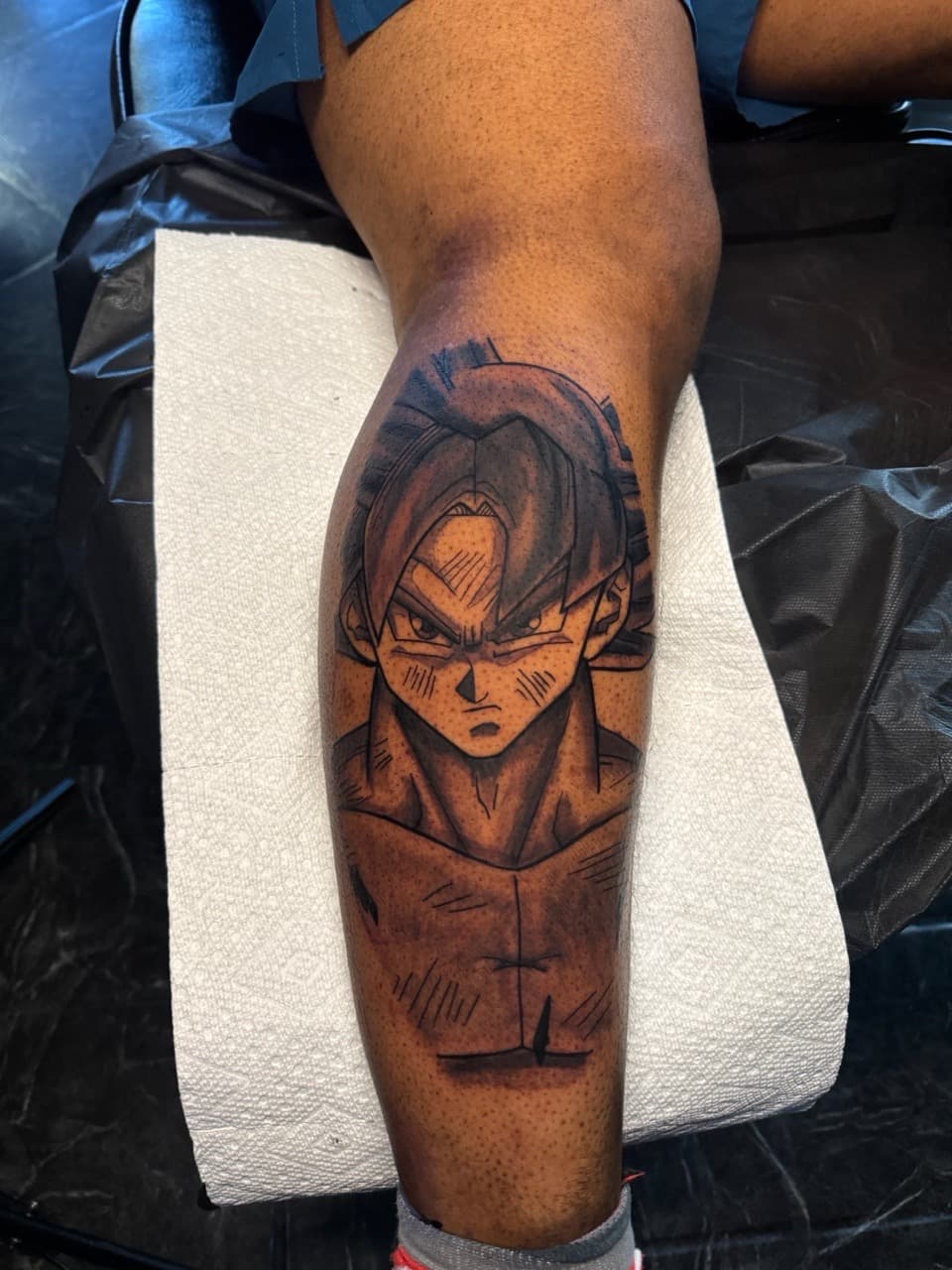 Anime + Black & Grey anime character tattoo on Calf by 1UP_Uncle_Frecks on TattMe