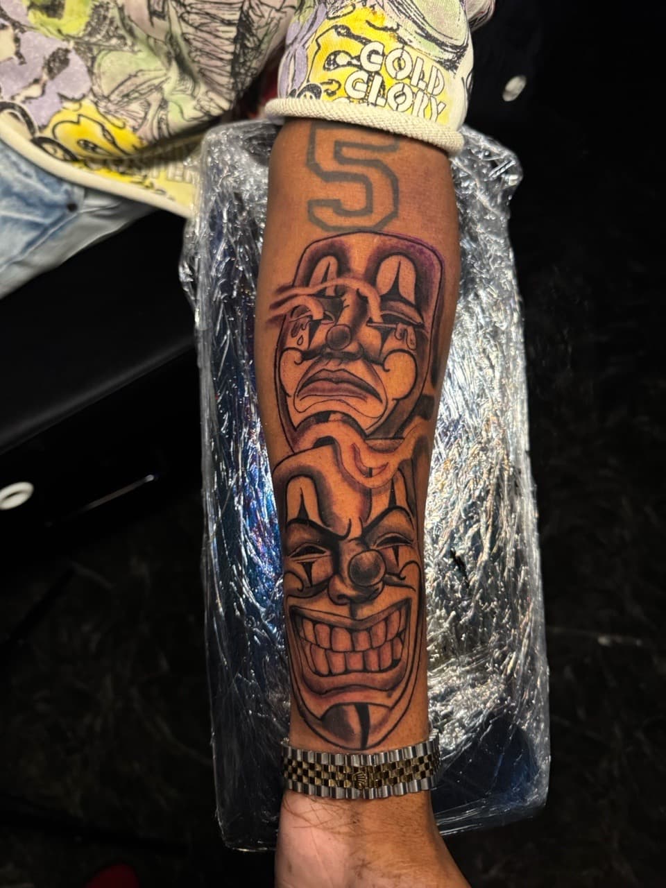 Black & Grey + Illustrative masks tattoo on Forearm by 1UP_Uncle_Frecks on TattMe