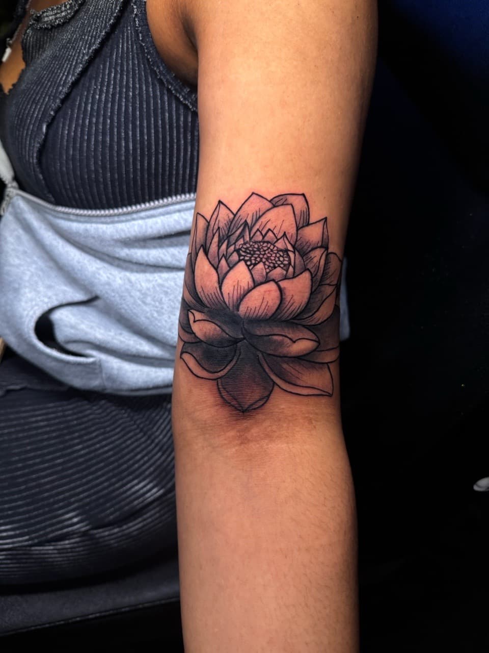 Black & Grey + Floral lotus tattoo on Upper Arm by 1UP_Uncle_Frecks on TattMe