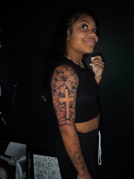 Black & Grey + Illustrative cross tattoo on Upper Arm by 1MoTatt on TattMe