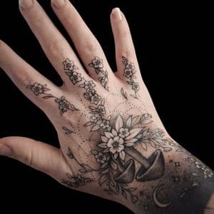 Fine Line + Black-work flowers tattoo on Hand by The_Alley_Tattoo_Studio on TattMe