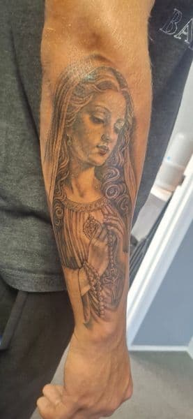 Black & Grey + Realism virgin mary tattoo on Forearm by The_Alley_Tattoo_Studio on TattMe