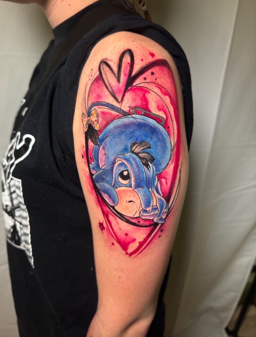 Color + Cartoon eeyore tattoo on Upper Arm by Inkflowjo on TattMe