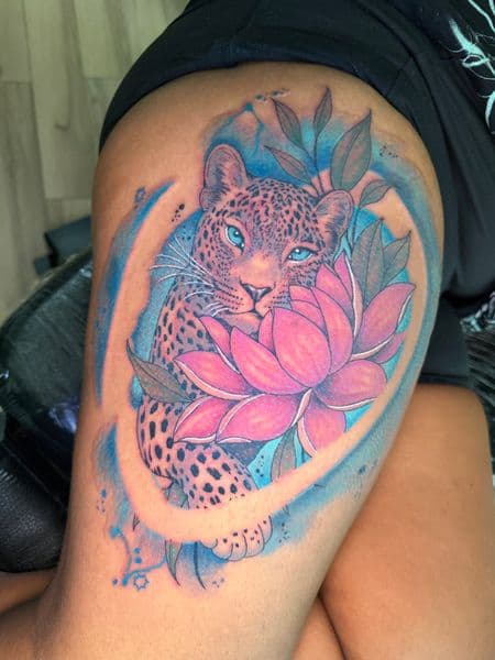 Color + Illustrative leopard tattoo on Thigh by Inkflowjo on TattMe