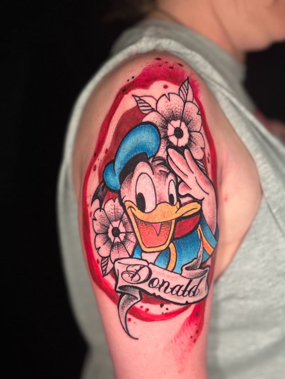Pop Culture + New School donald duck tattoo on Upper Arm by Inkflowjo on TattMe