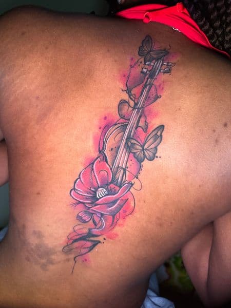 Watercolor + Illustrative violin tattoo on Upper Back by Inkflowjo on TattMe