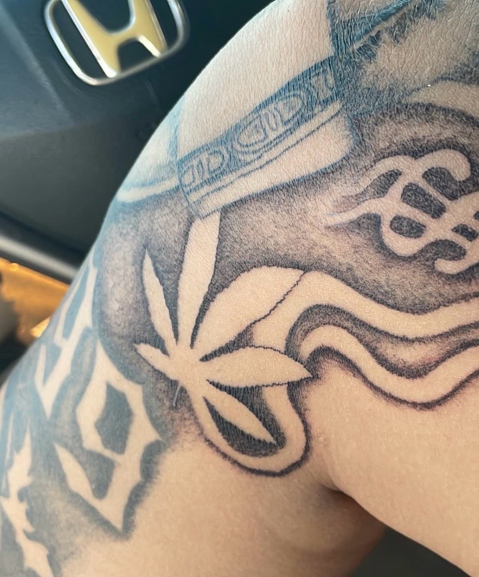 Black & Grey cannabis leaf tattoo on Upper Arm by inktherapy_1 on TattMe