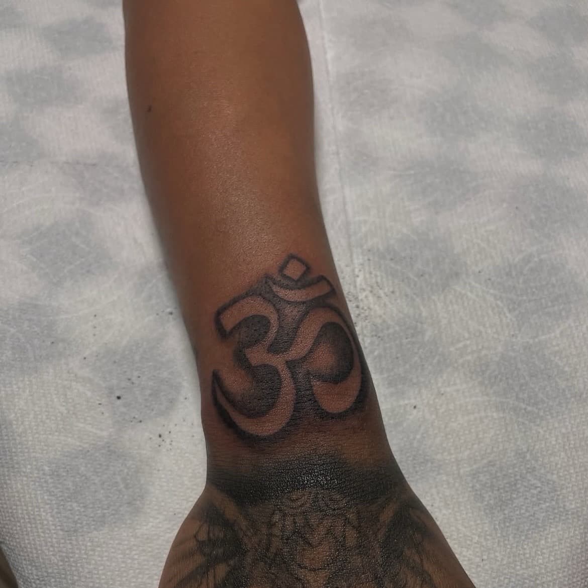 Black-work + Symbolic om symbol tattoo on Wrist by inktherapy_1 on TattMe