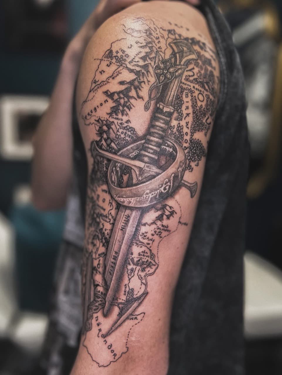 Black & Grey + Illustrative sword tattoo on Upper Arm by Ashley_Jolly_Tattoo on TattMe