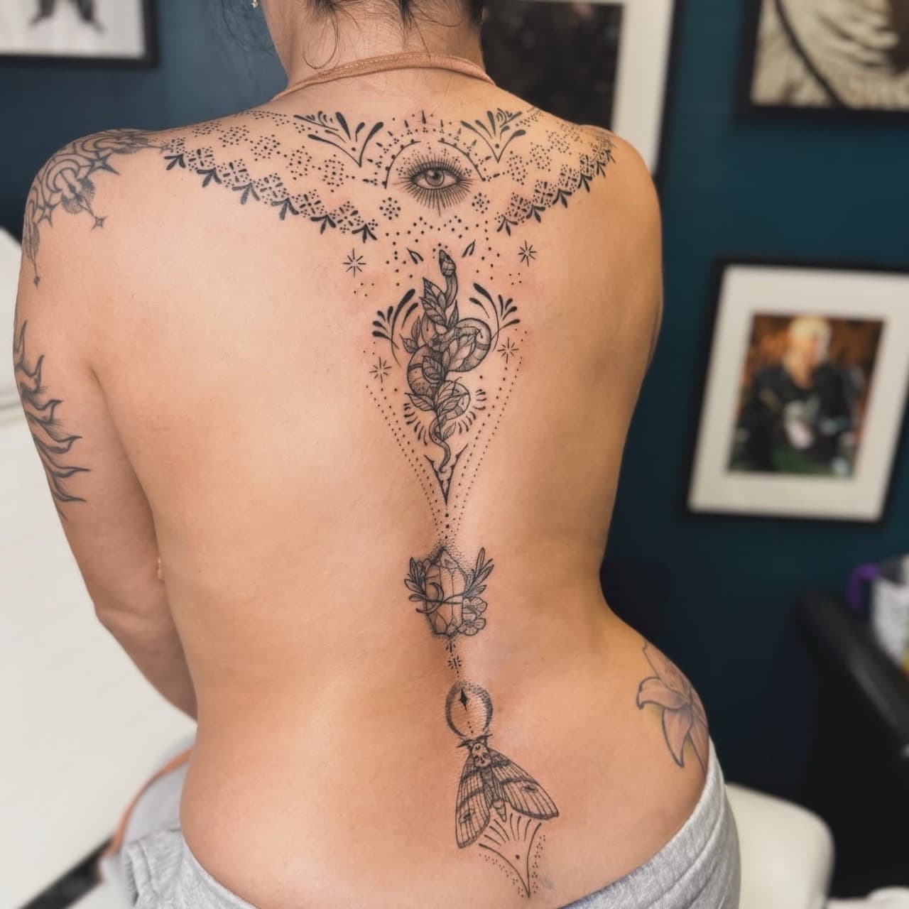 Fine Line + Black-work eye tattoo on Spine by Ashley_Jolly_Tattoo on TattMe