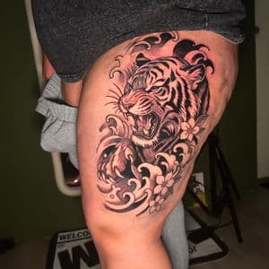 Black & Grey + Color tiger tattoo on Thigh by KC on TattMe