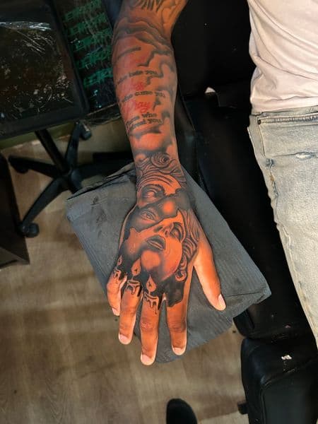 Black & Grey + Illustrative faces tattoo on Hand by KC on TattMe