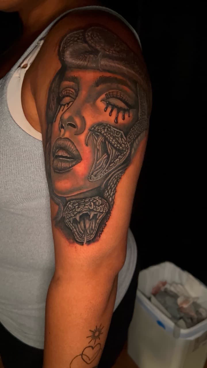 Black & Grey + Realism woman tattoo on Upper Arm by KC on TattMe