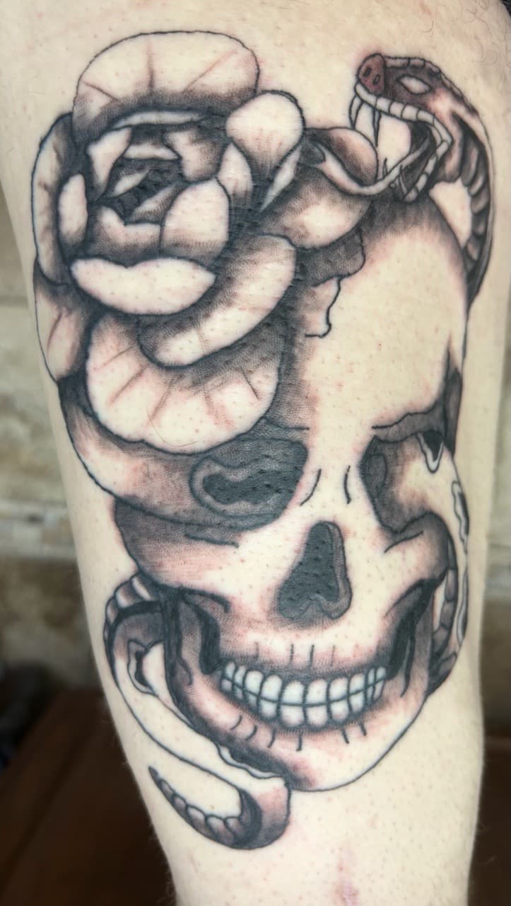 Black & Grey + Illustrative skull tattoo on Upper Arm by Apex_Effort_Studio on TattMe