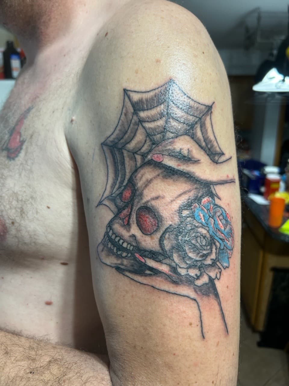 Black & Grey + Color skull tattoo on Upper Arm by Apex_Effort_Studio on TattMe