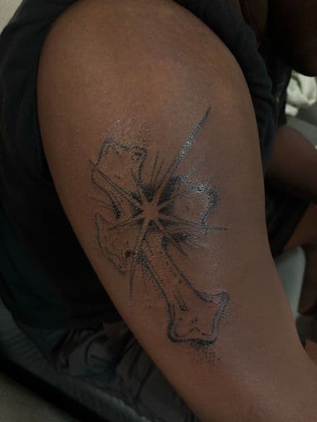 Black-work cross tattoo on Upper Arm by tatsbyrayyy on TattMe
