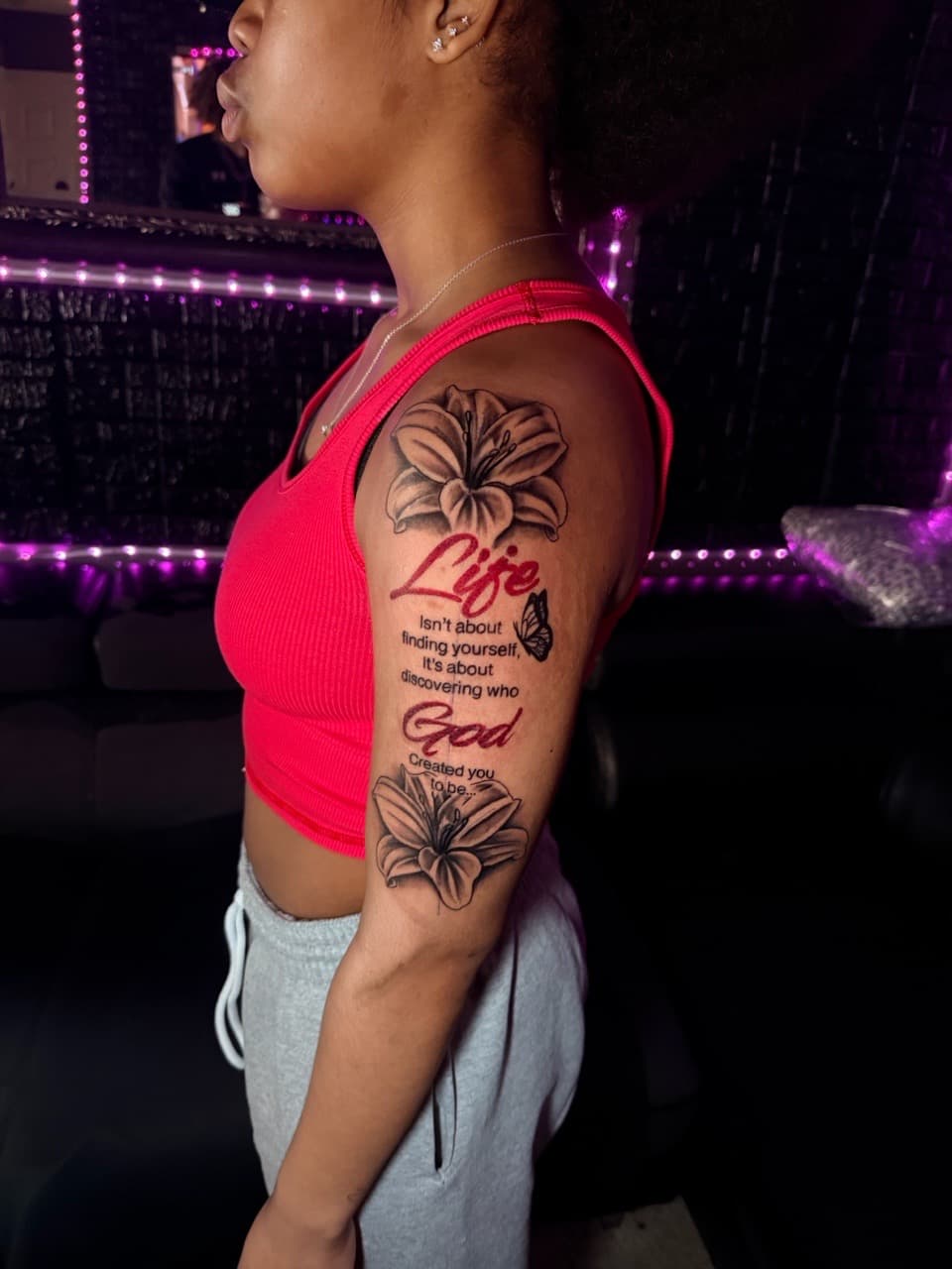 Black & Grey + Lettering lily tattoo on Upper Arm by sixxinked on TattMe