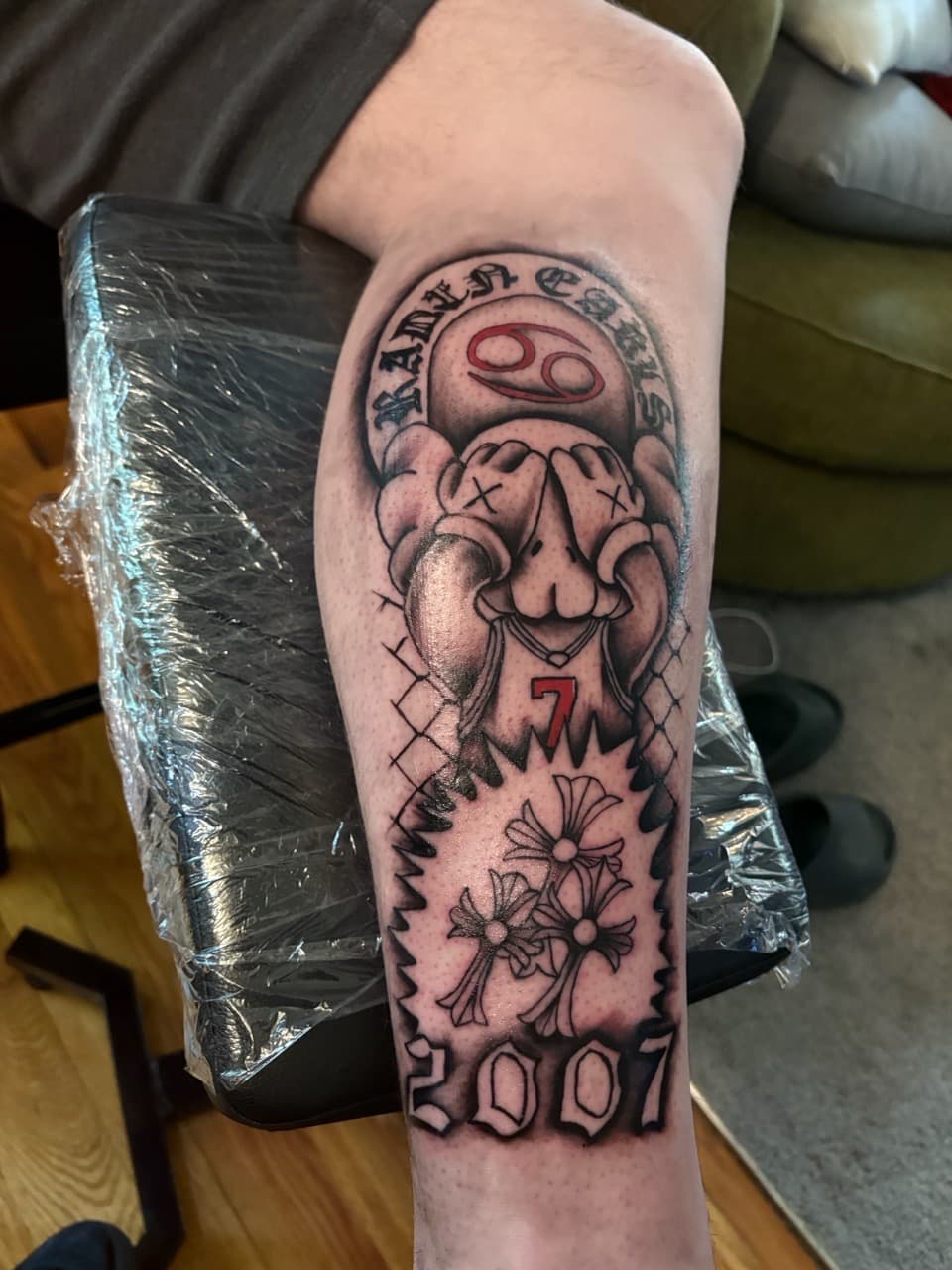 Black & Grey + Illustrative kaws character tattoo on Calf by MaleekInkz on TattMe