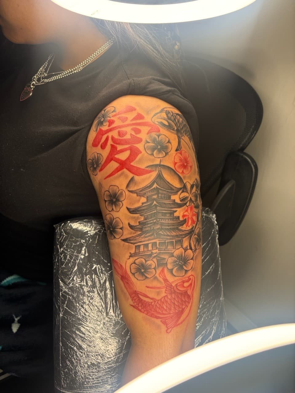 Japanese + Lettering pagoda tattoo on Upper Arm by MaleekInkz on TattMe