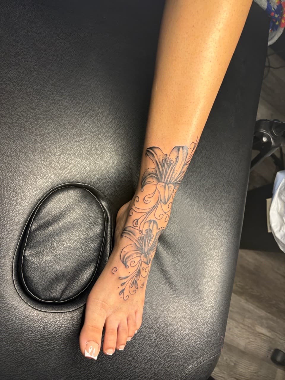 Fine Line + Black & Grey lilies tattoo on Foot by MaleekInkz on TattMe