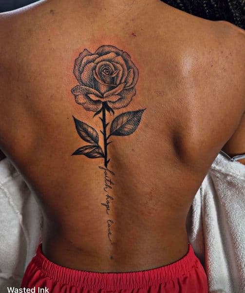 Black & Grey + Lettering rose tattoo on Spine by Wasted_Ink on TattMe
