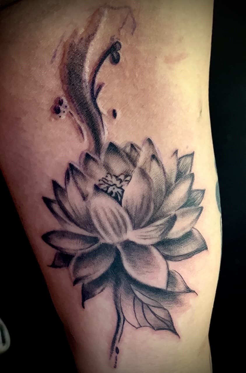 Black & Grey + Floral lotus tattoo on Upper Arm by Rey_Sanchez on TattMe