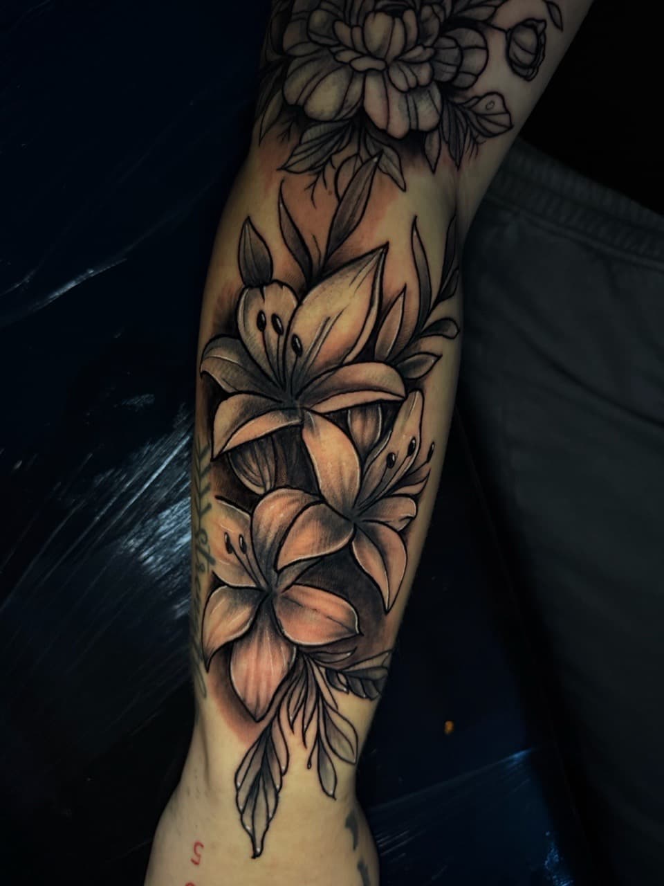 Black & Grey + Floral lilies tattoo on Forearm by Rey_Sanchez on TattMe