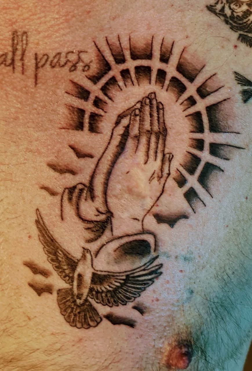 Black & Grey + Illustrative praying hands tattoo on Chest by Night_Veil_Ink on TattMe