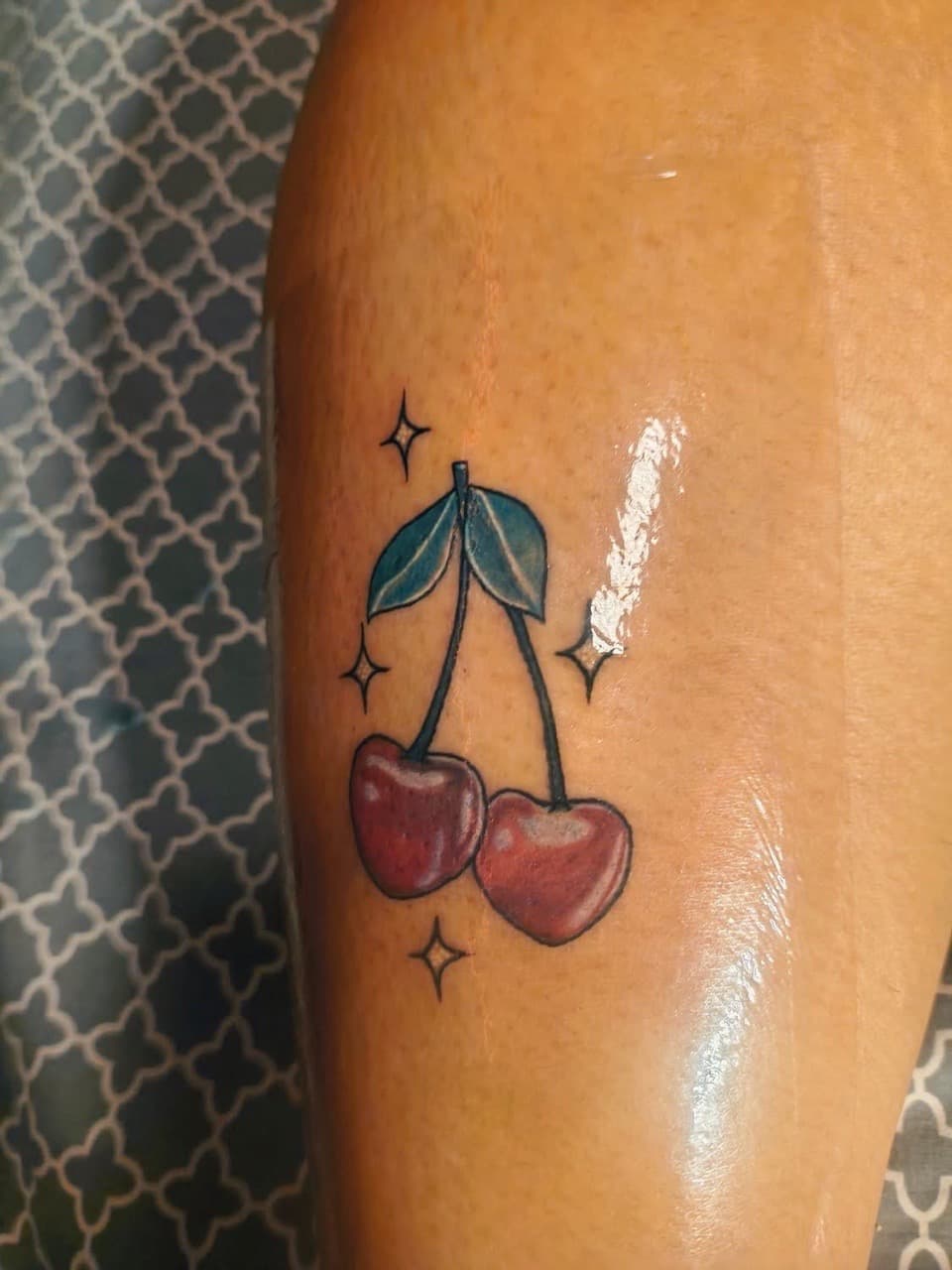 Color + Illustrative cherries tattoo on Thigh by Night_Veil_Ink on TattMe
