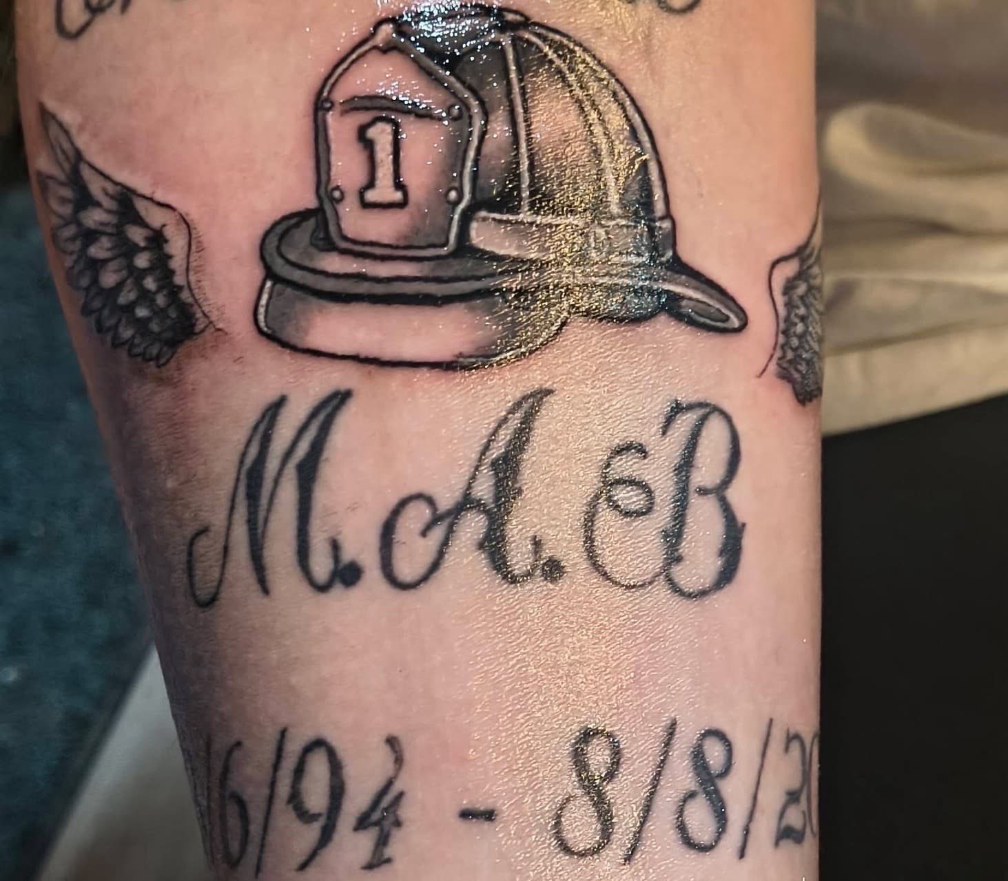 Black & Grey + Lettering firefighter helmet tattoo on Forearm by Night_Veil_Ink on TattMe