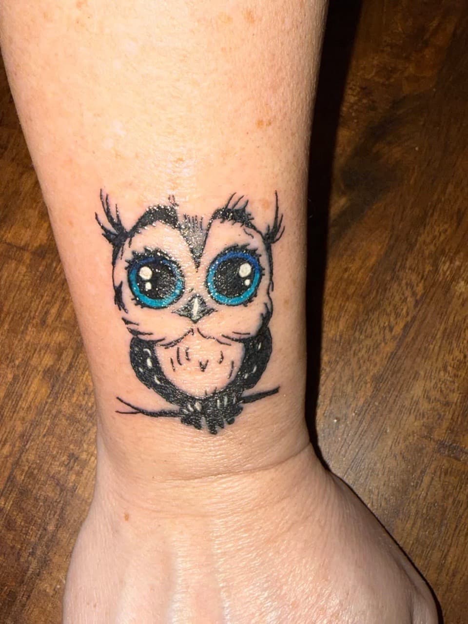 Cartoon + Color owl tattoo on Wrist by Night_Veil_Ink on TattMe