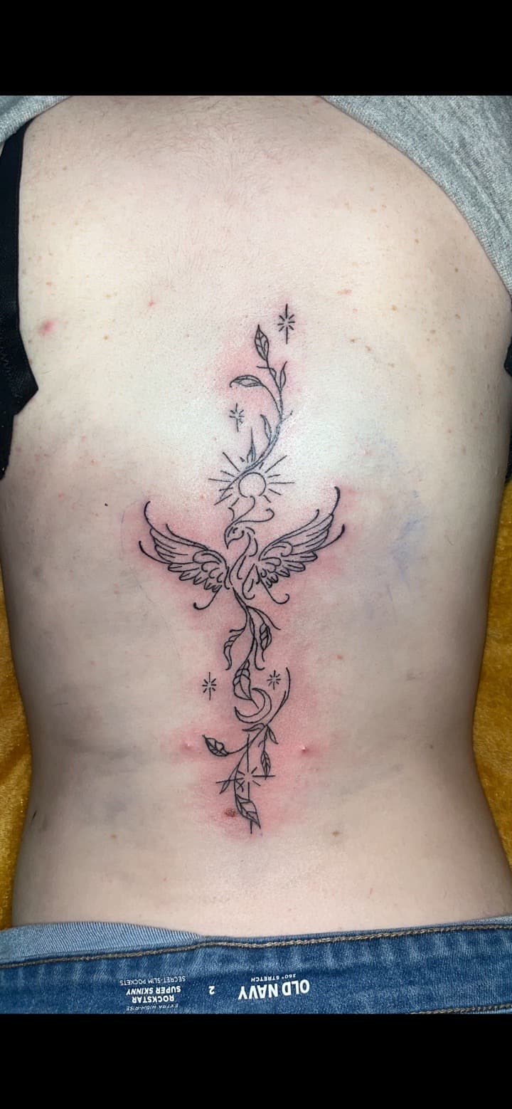 Fine Line + Black-work phoenix tattoo on Spine by JrrrInkkk on TattMe