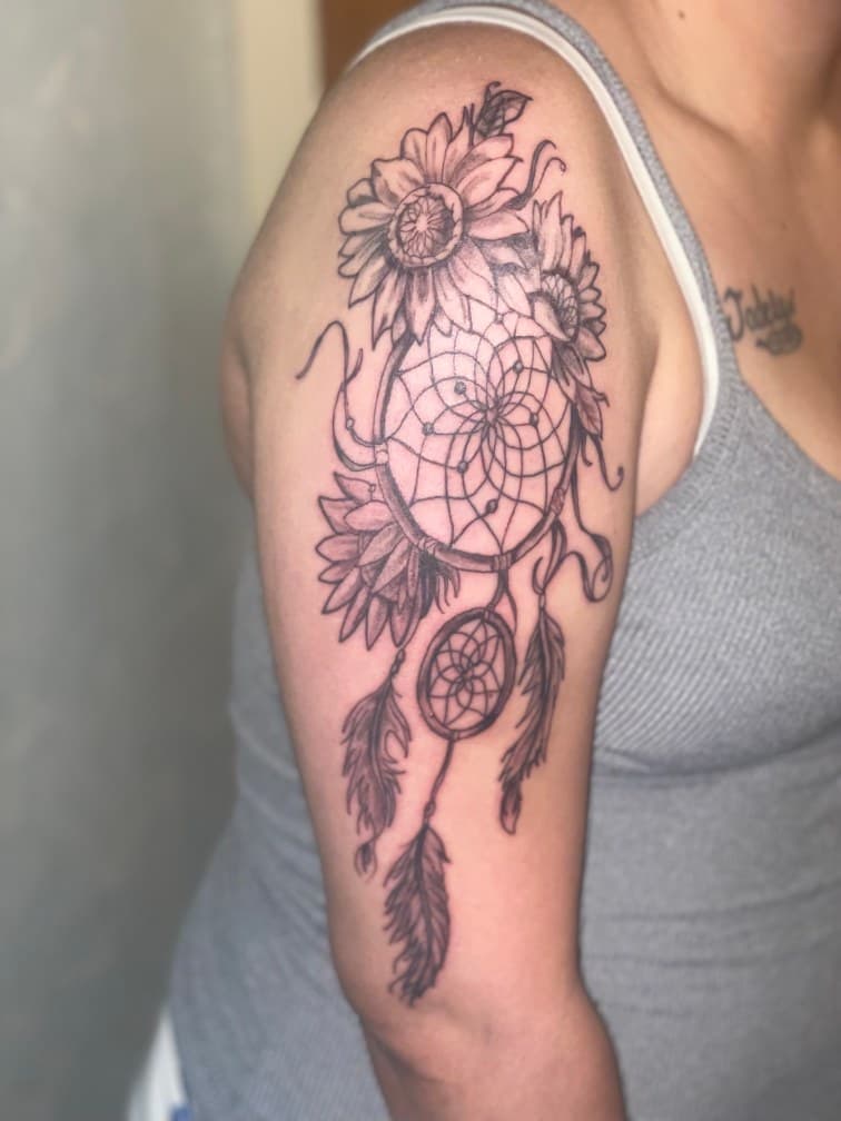 Black & Grey + Illustrative dreamcatcher tattoo on Upper Arm by Jamarious_Cook on TattMe