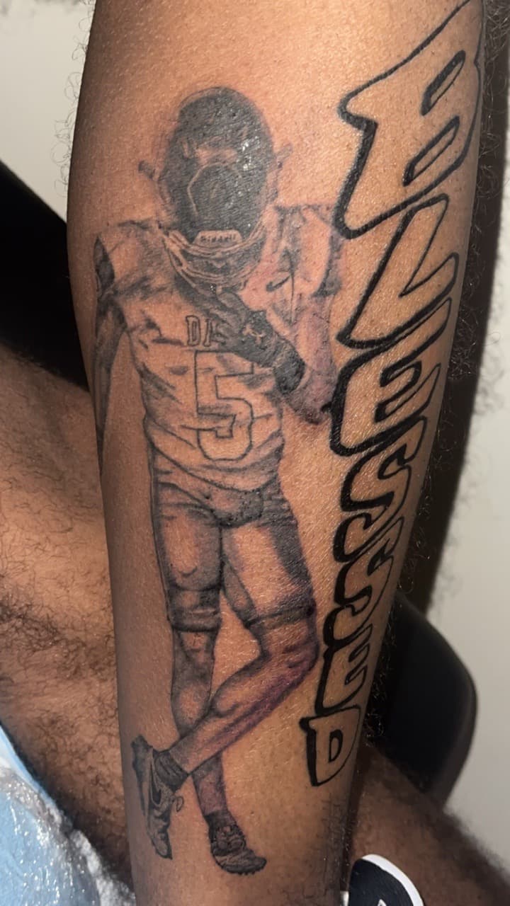 Black & Grey + Realism football player tattoo on Calf by Jamarious_Cook on TattMe
