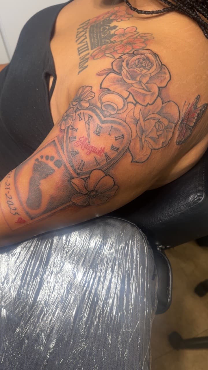 Black & Grey + Floral flowers tattoo on Upper Arm by Jamarious_Cook on TattMe