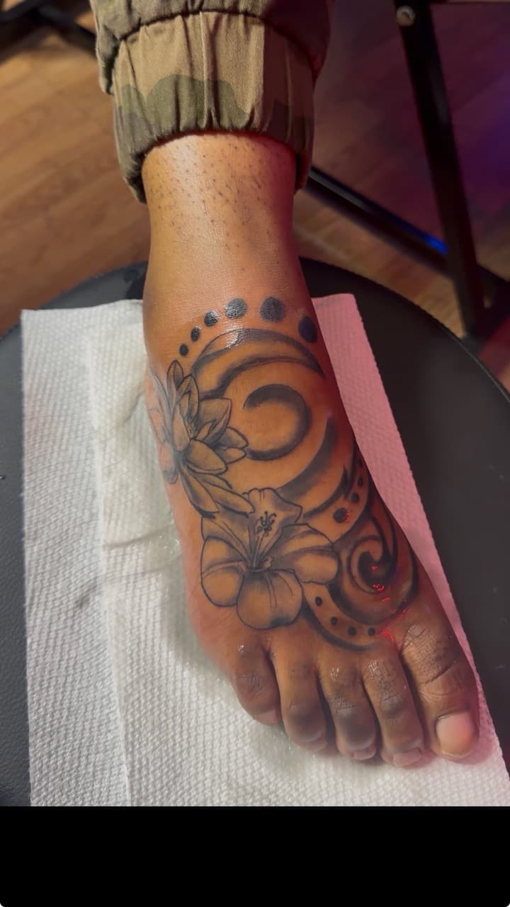 Floral + Black & Grey flowers tattoo on Foot by Speedytattoos on TattMe