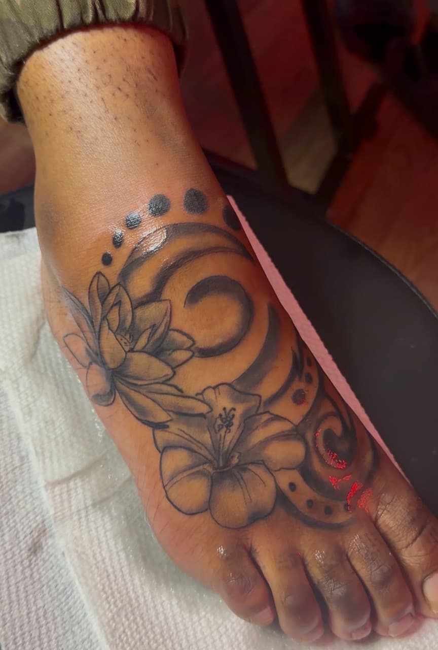 Black & Grey + Floral flowers tattoo on Foot by Speedytattoos on TattMe