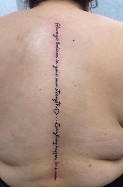 Lettering + Fine Line script tattoo on Spine by NOBDYSUPPRTART on TattMe