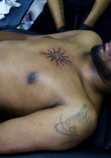 Black-work + Line-work sun tattoo on Sternum by NOBDYSUPPRTART on TattMe