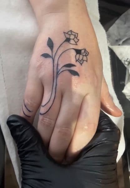 Fine Line + Floral flowers tattoo on Hand by NOBDYSUPPRTART on TattMe