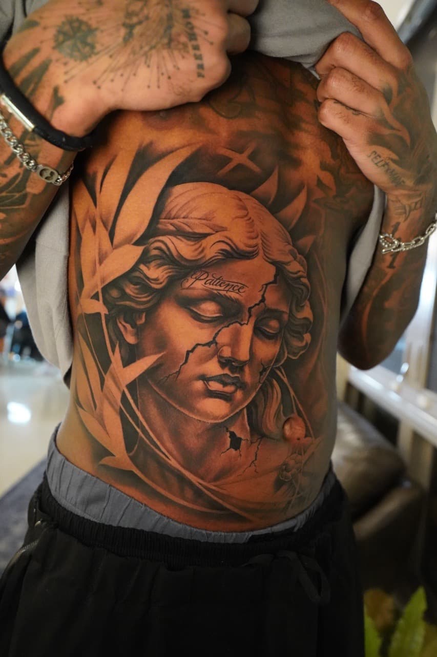 Realism + Black & Grey statue tattoo on Upper Back by 16thRich on TattMe