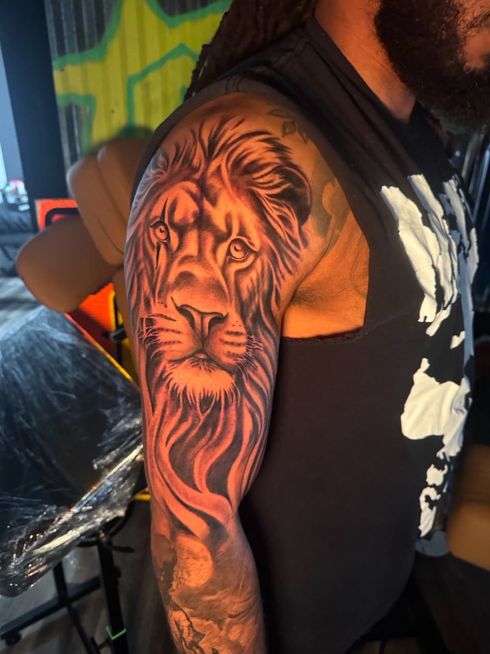 Realism + Black & Grey lion tattoo on Upper Arm by Inkheadz on TattMe