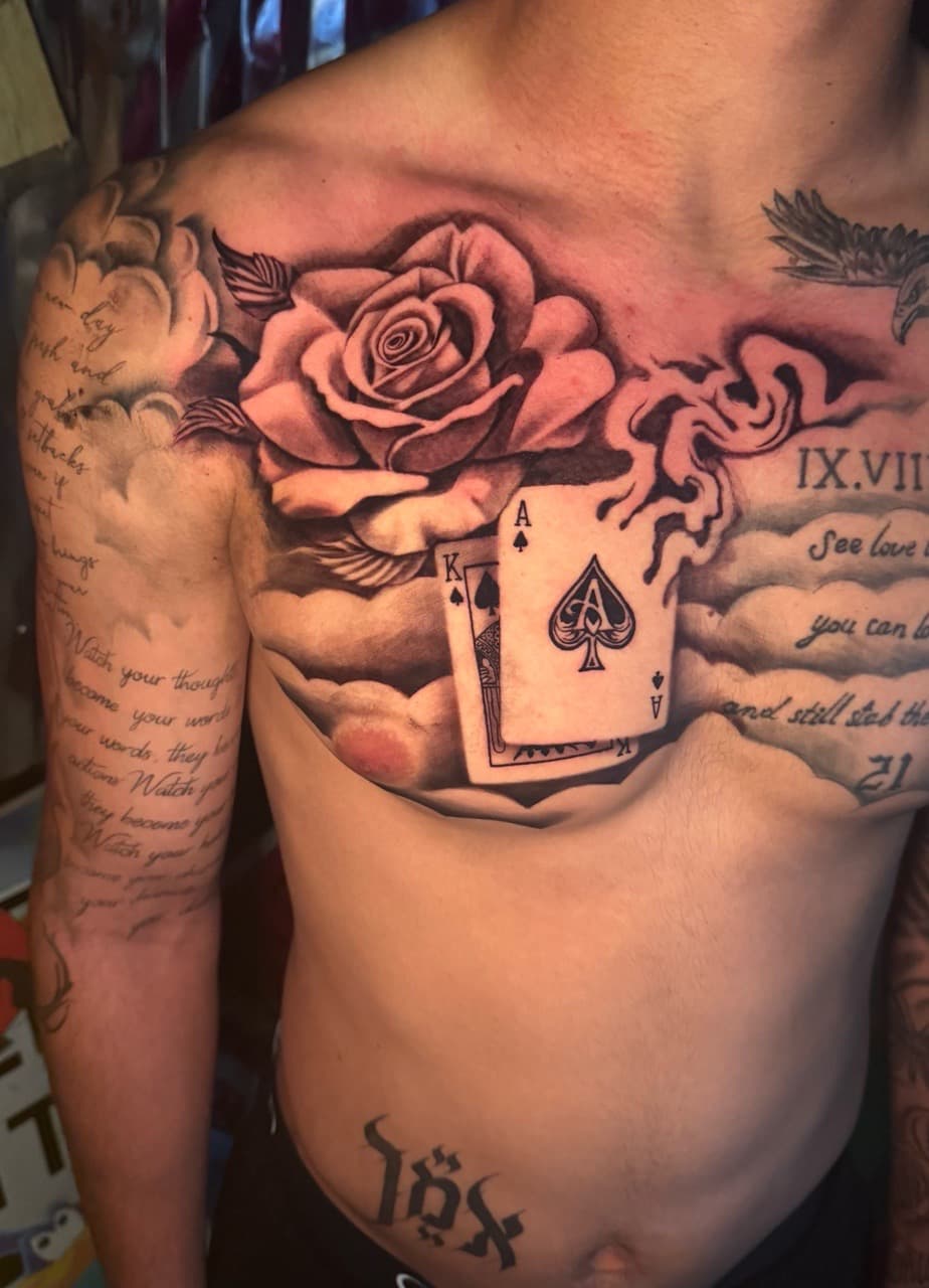 Black & Grey + Realism rose tattoo on Chest by Inkheadz on TattMe